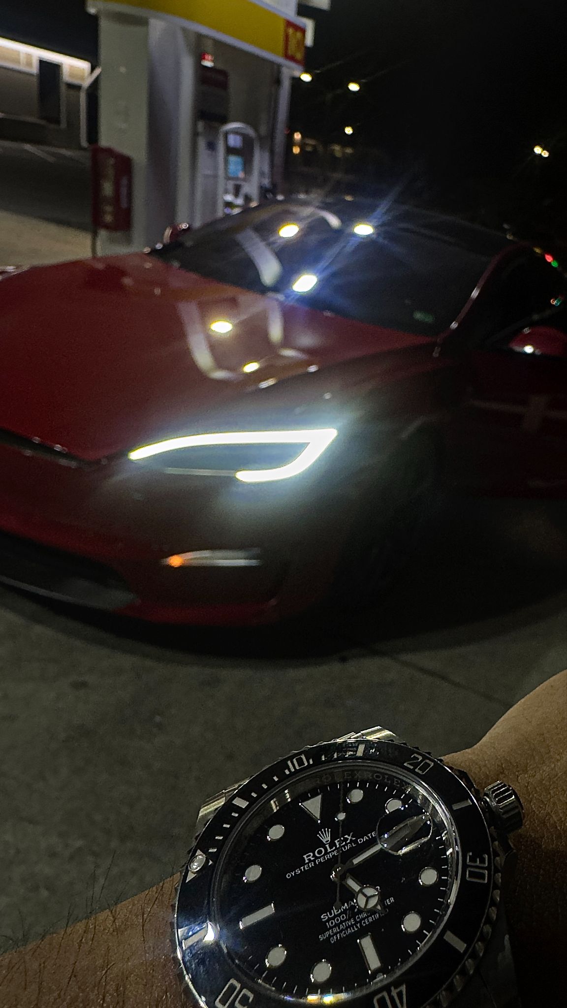 Red car and watch at night